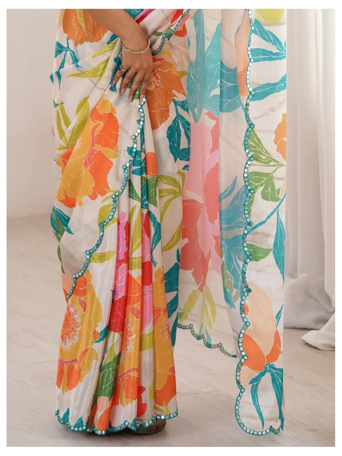 Tarani off white chinnon saree closeup showing paper mirror work border