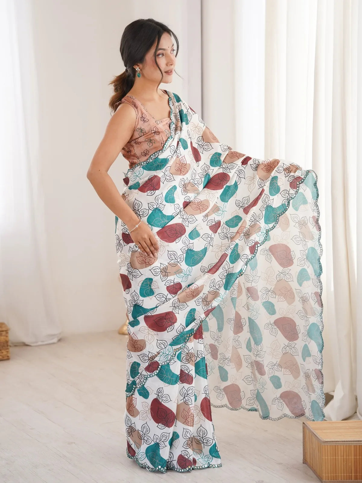 Tarani off white heavy chinnon saree side-view showcasing print and mirror border
