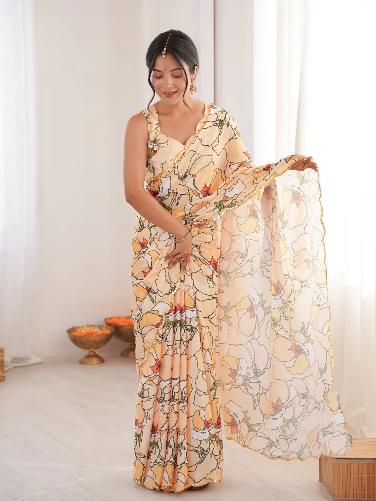 Tarani peach chinnon saree with full view showcasing printed floral design and mirror work border