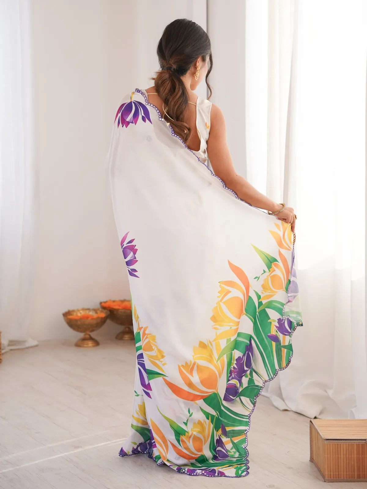 Tarani white party wear saree with yellow purple floral prints and back pallu view of blouse design