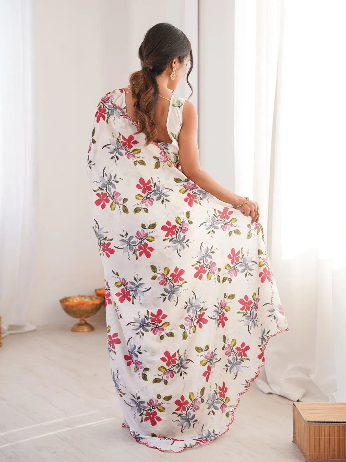Tarani festive white printed chinnon saree back view with elegant drape
