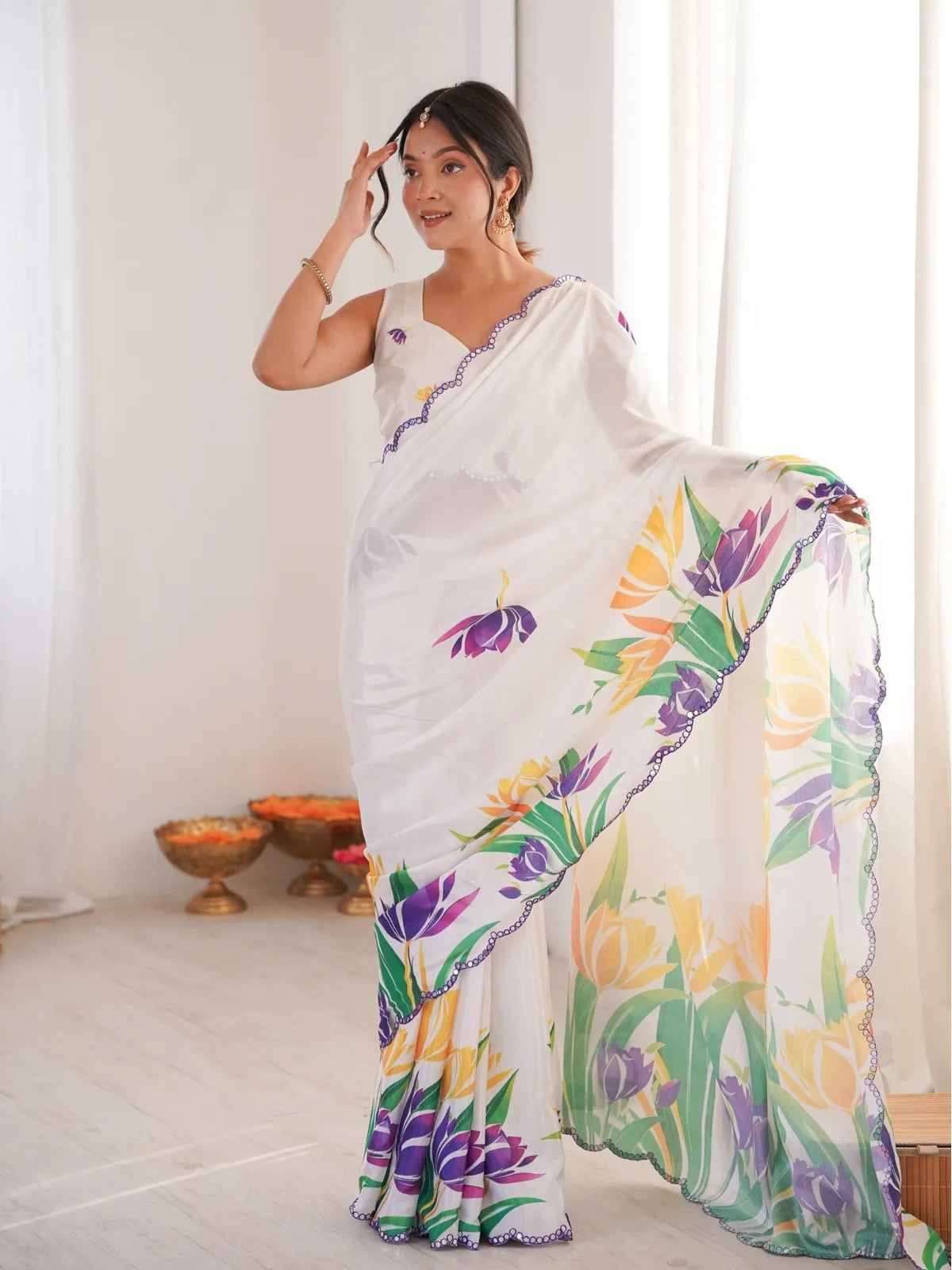 Tarani elegant white printed chinnon saree with floral pallu and mirror work border in full view