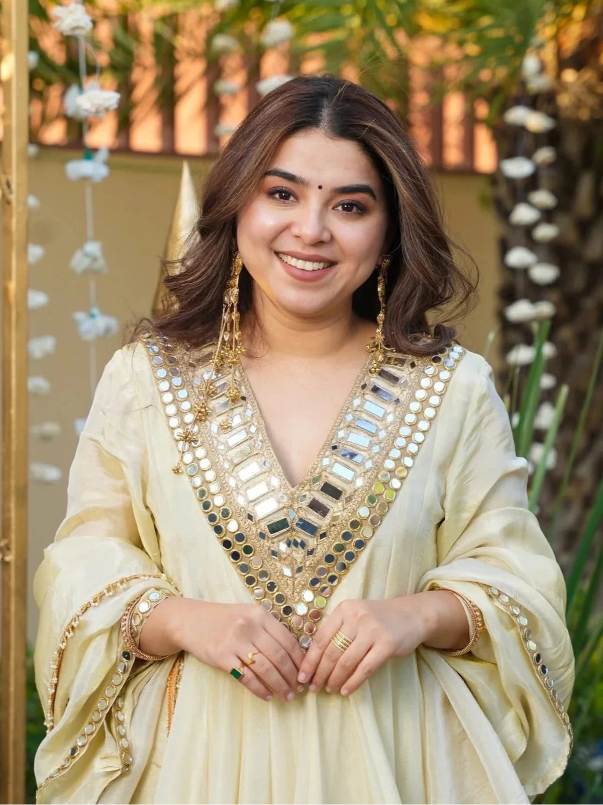 Tarani beige chinon dress close-up showing mirror work neckline and sleeves