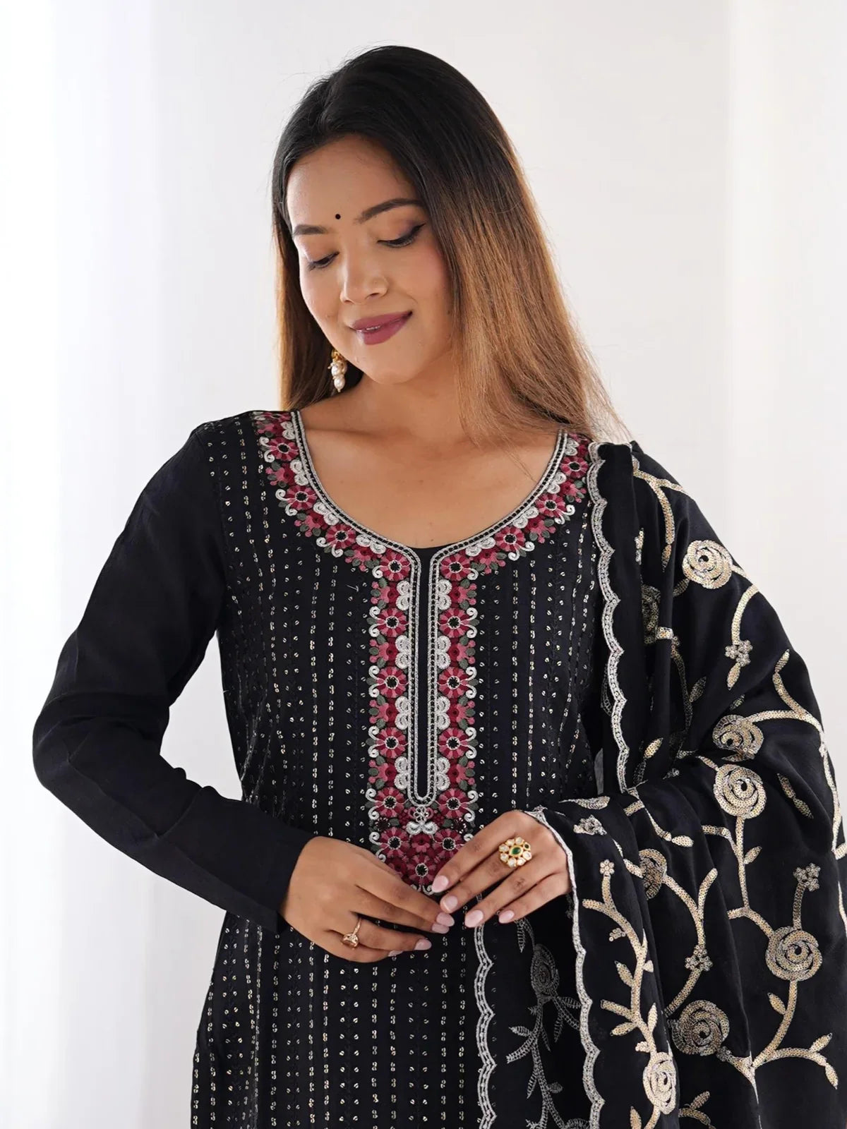 Tarani elegant black chinon silk dress close-up showing neckline embroidery and soft inner micro lining