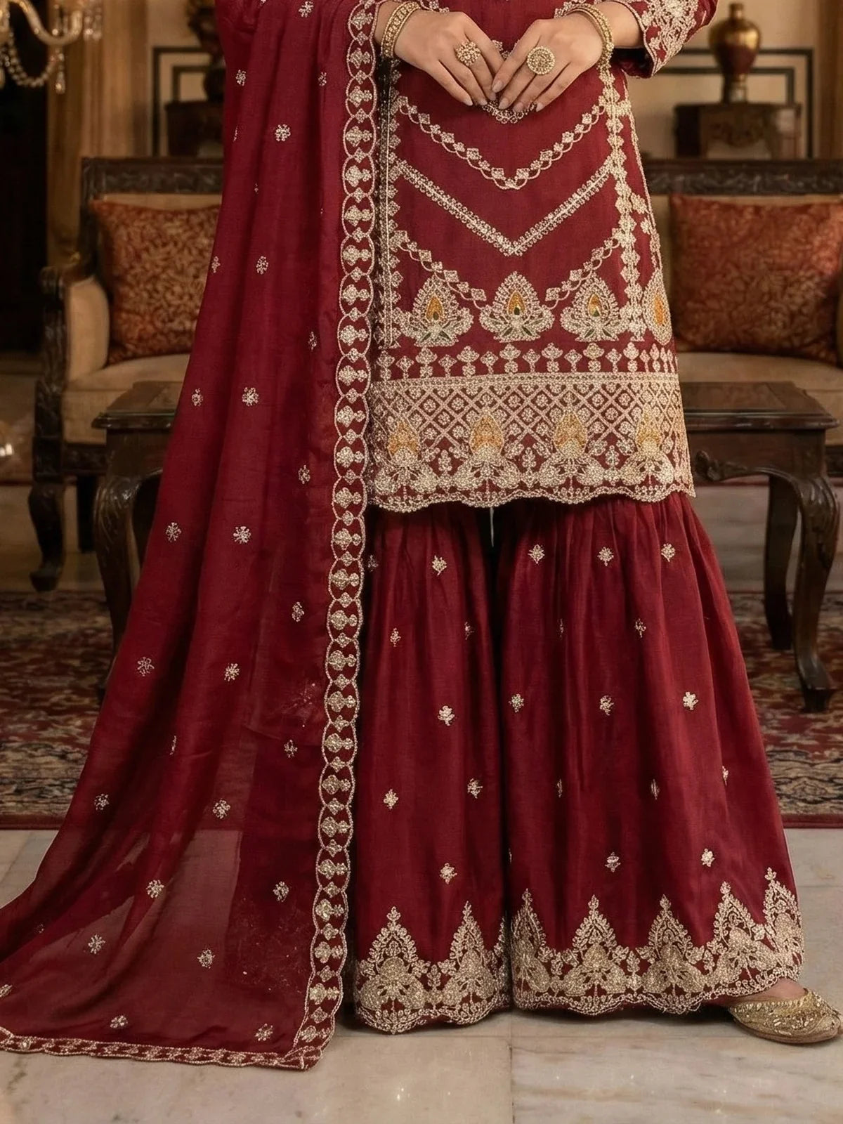 Tarani maroon chinon sharara suit closeup of dupatta border and embroidery details in luxury setting