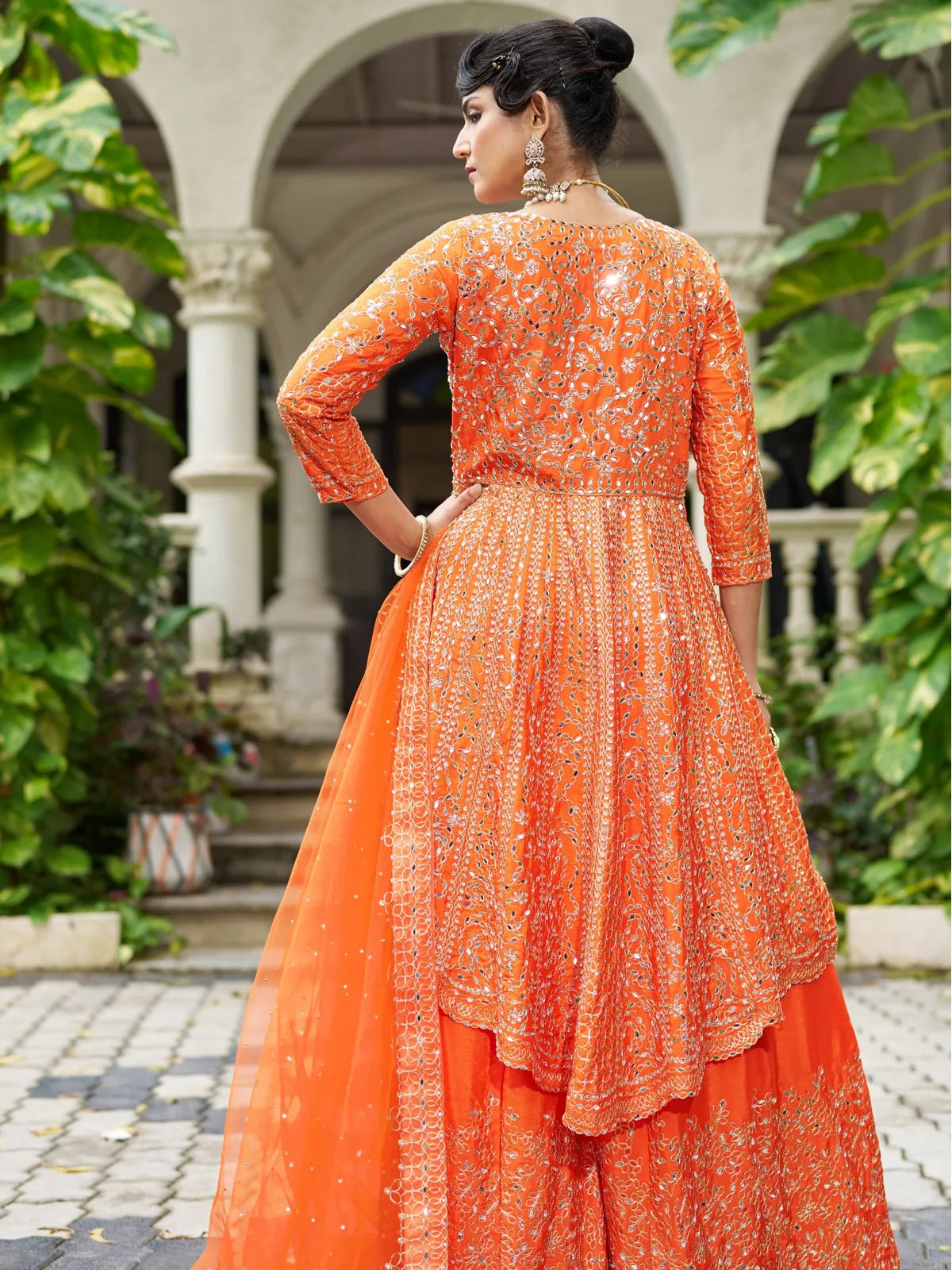 Tarani orange Chinon dress back view showing heavy mirror embroidery on top and dupatta drape