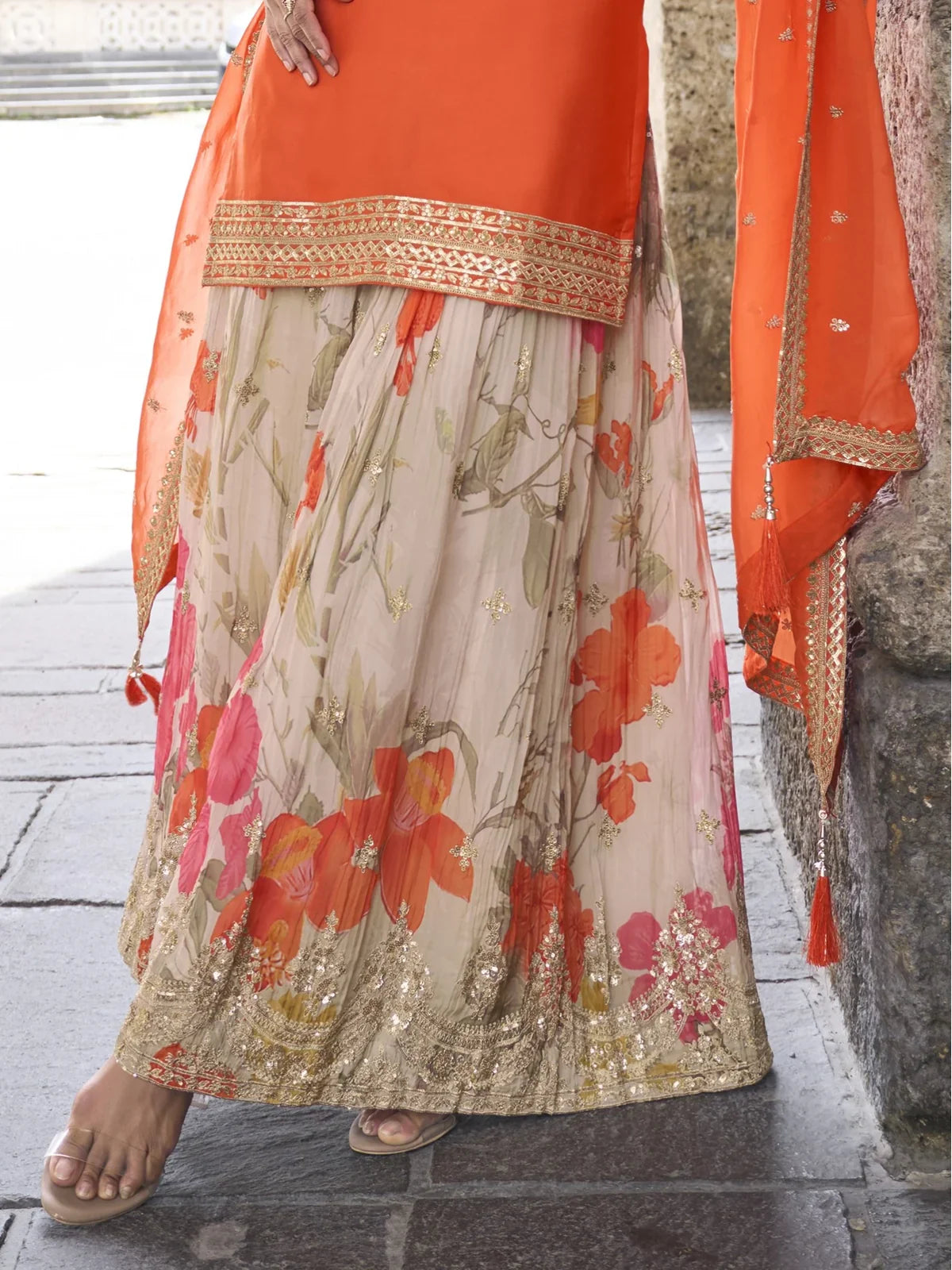 Tarani chinon orange suit closeup view showing fabric and zari work embroidery