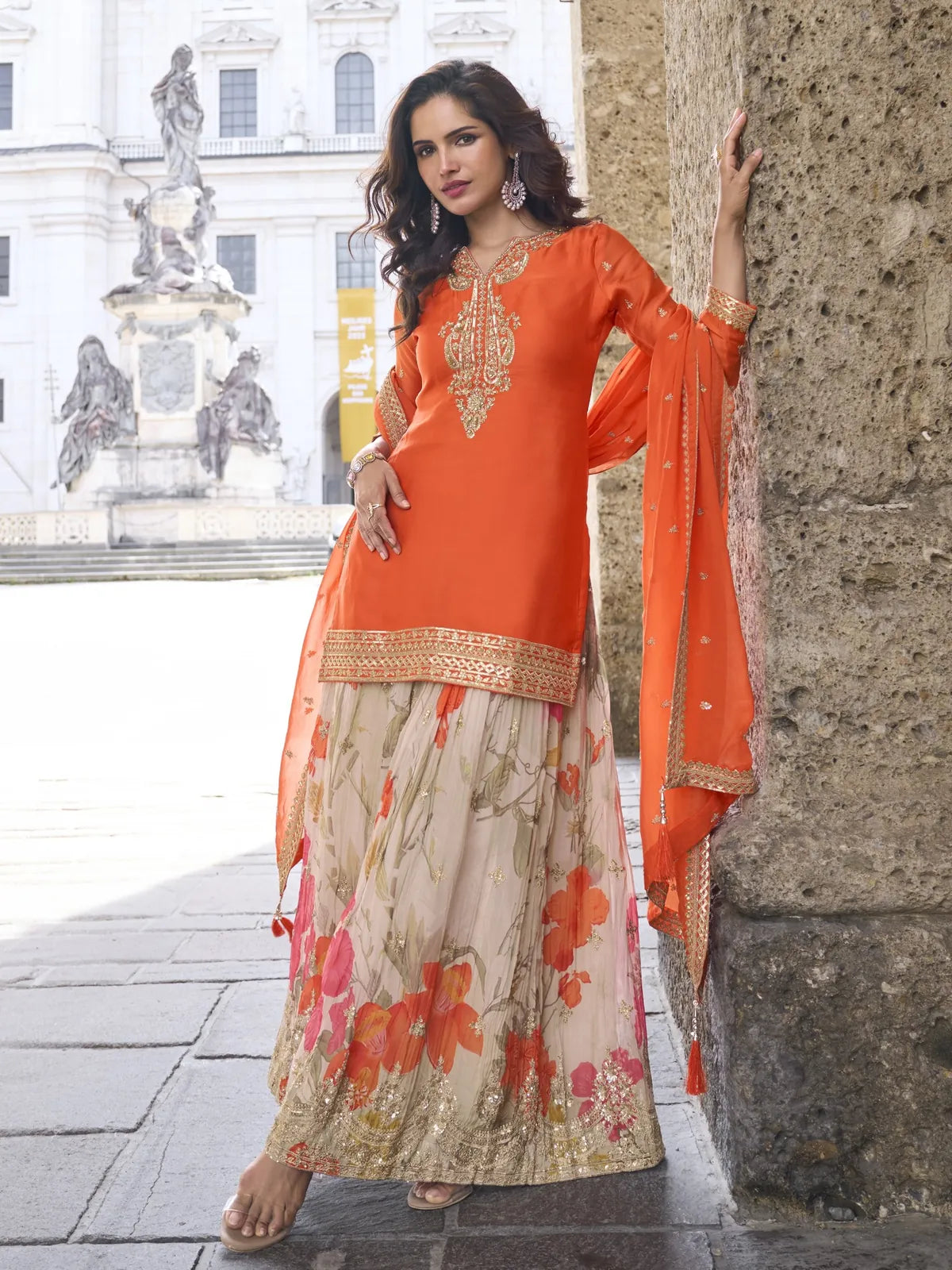 Tarani chinon orange suit front view with sharara palazzo and dupatta