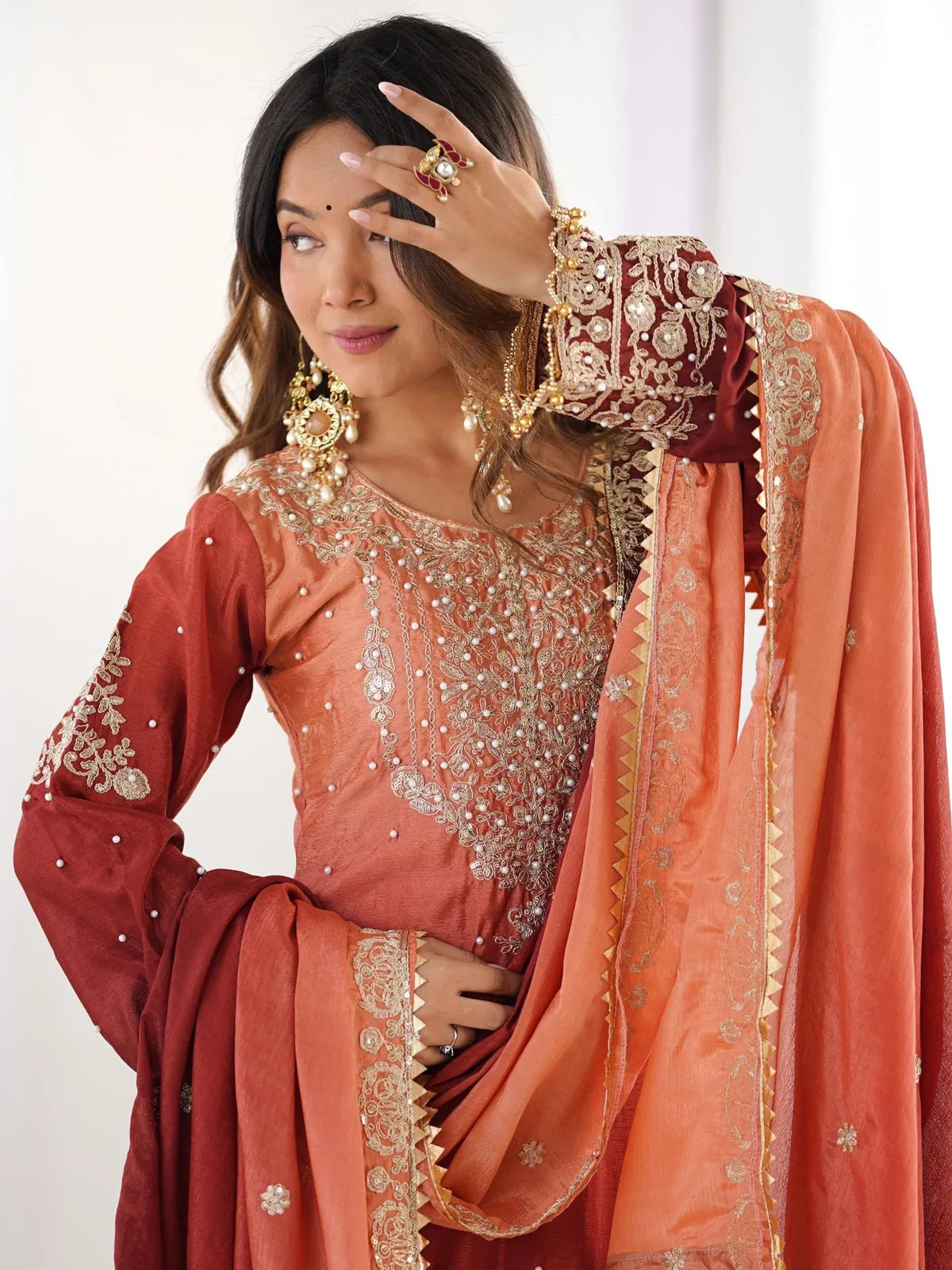 Tarani premium chinon orange dress close-up showing neckline embroidery and sleeves