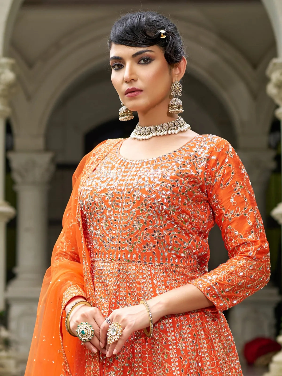 Tarani orange embroidered Chinon dress upper body close-up showing neckline and sleeve work with jewellery