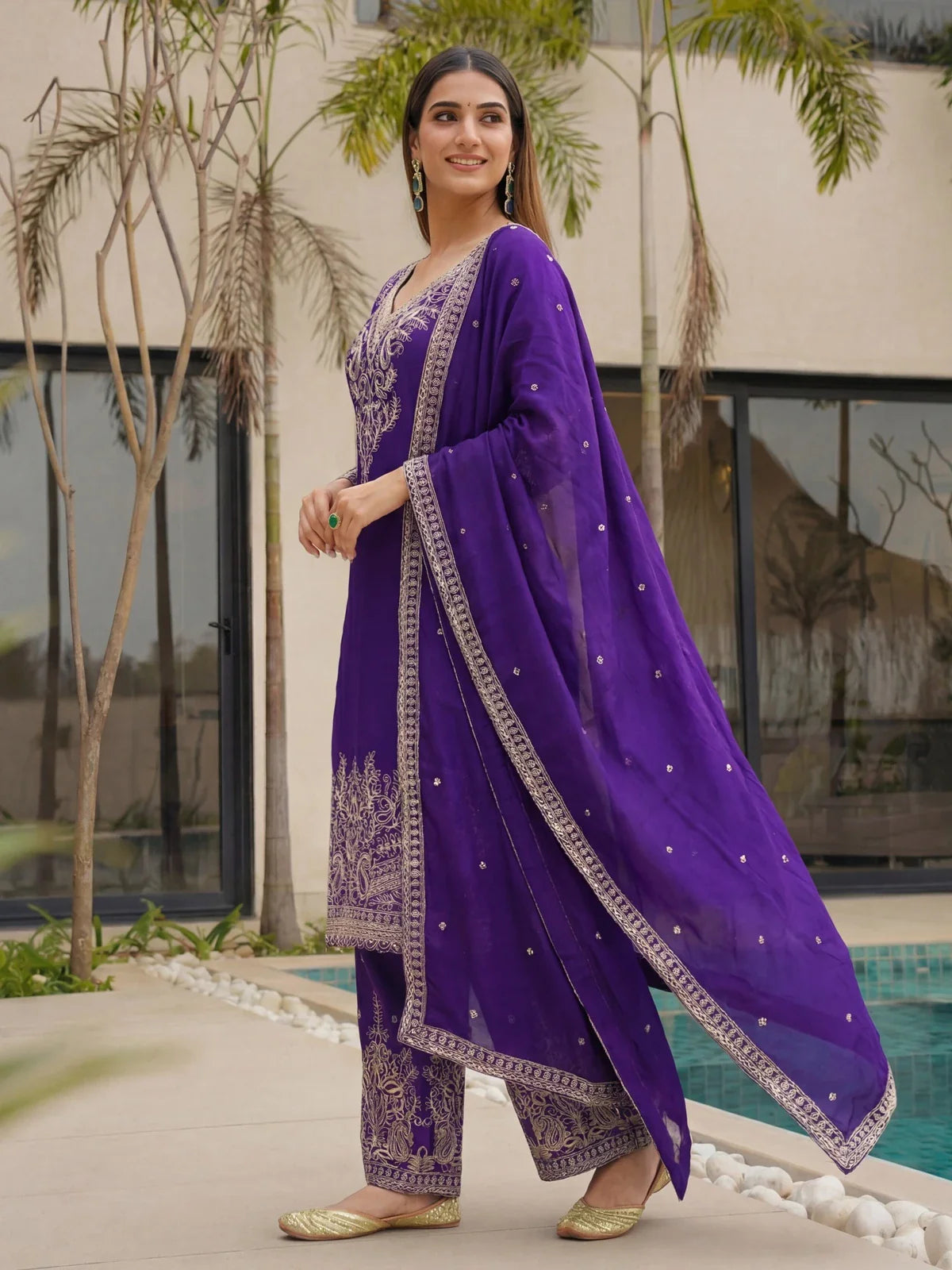 Tarani purple chinon silk suit with dupatta flowing side profile and golden work detail