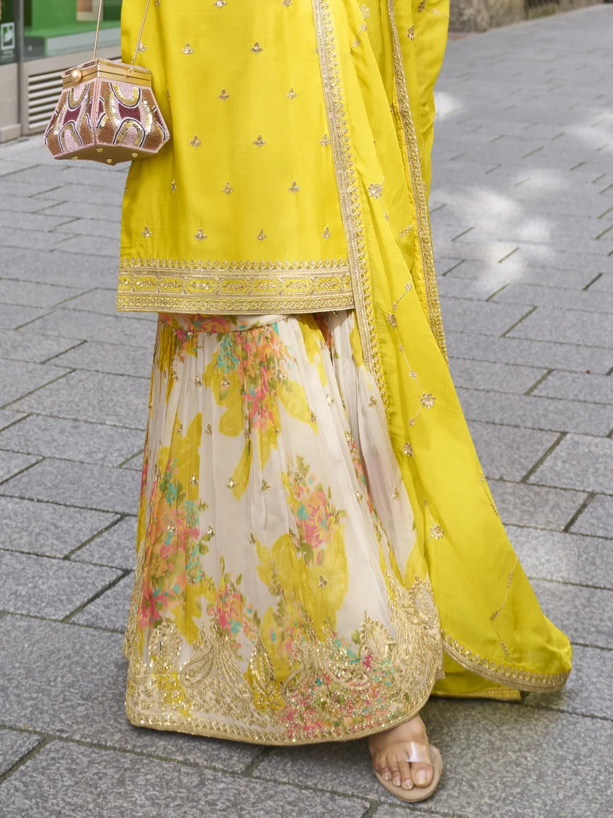 Tarani yellow chinon sharara suit closeup of embroidery and printed sharara