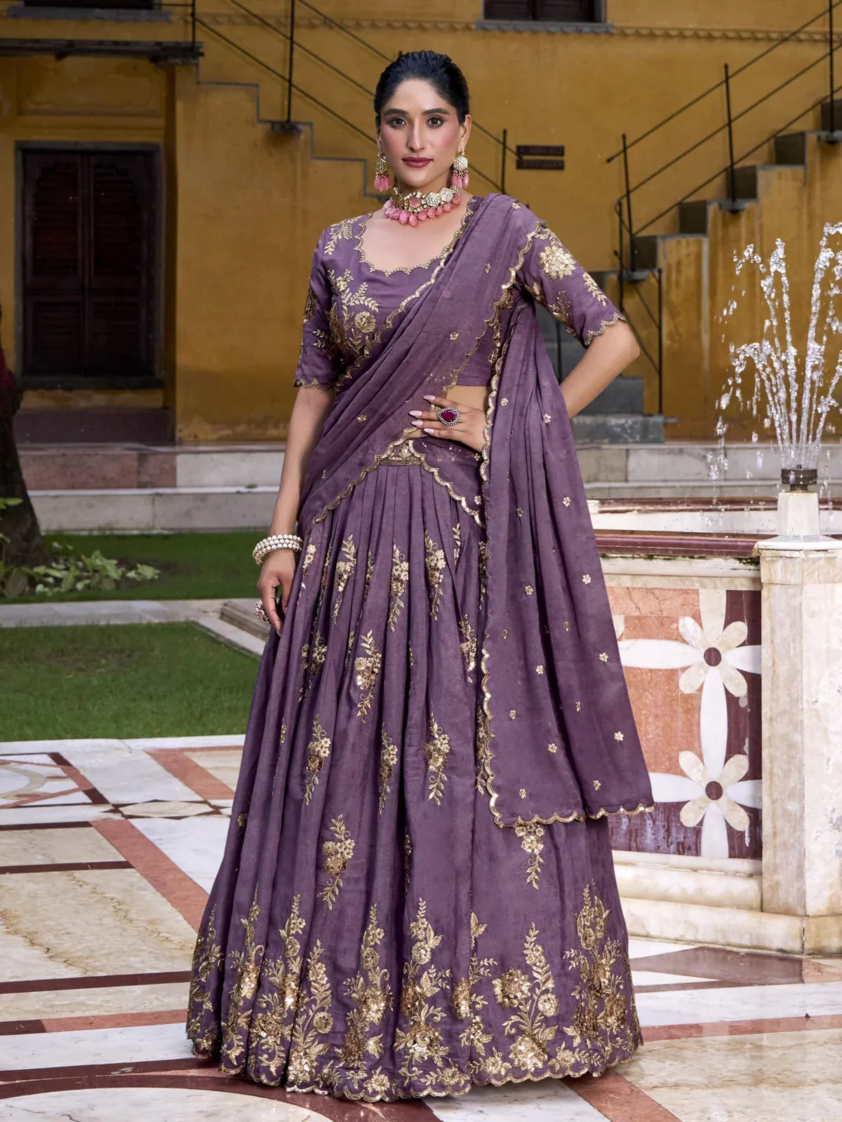 Tarani purple lehenga in chocolate crush fabric with golden embroidery and matching dupatta front full view