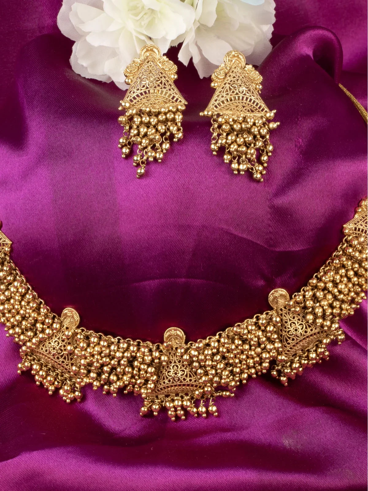 Tarani closeup gold choker set with detailed beaded antique design