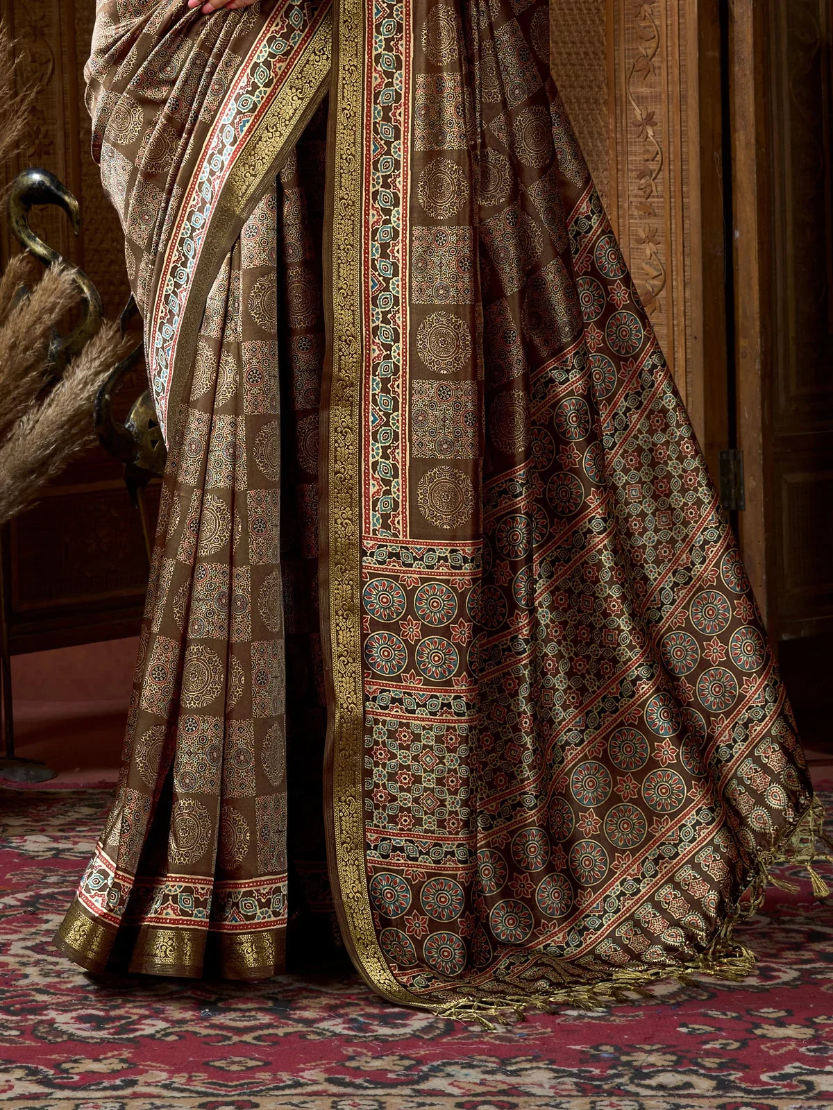 Tarani brown ajrak printed saree pallu and jacquard jhallar border detailing