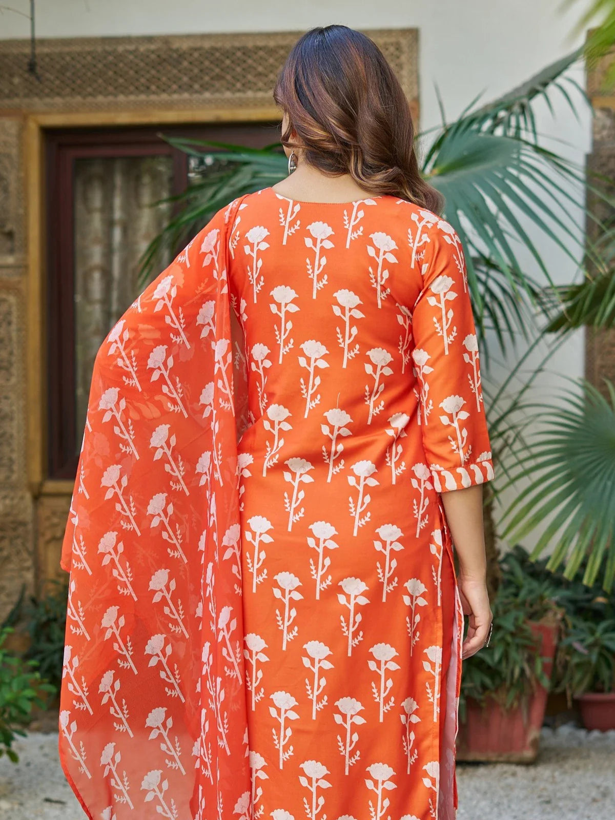 Tarani orange printed salwar suit back design with flowing dupatta
