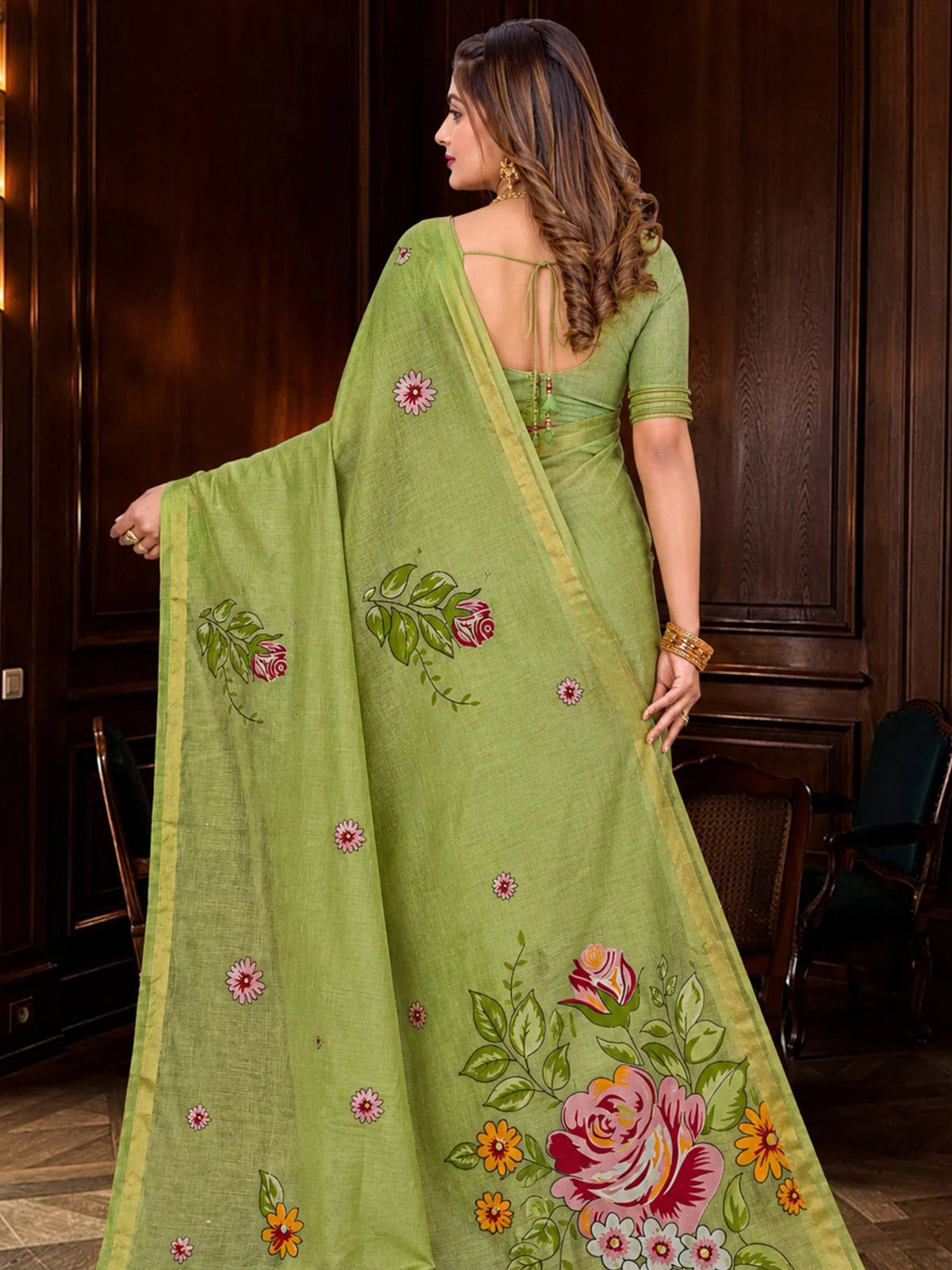 Tarani green cotton blend saree back view with floral pallu and zari border