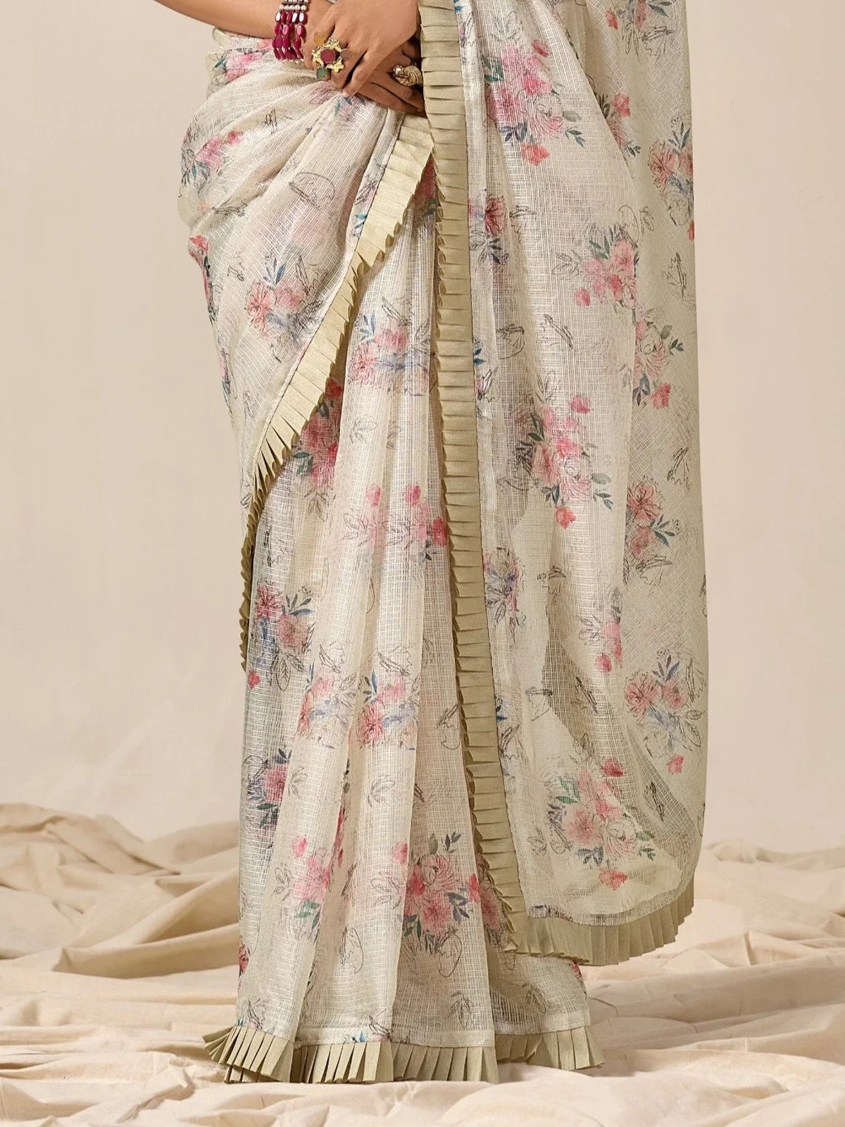 Tarani off white Kota cotton saree closeup view showing soft pleated border and floral texture