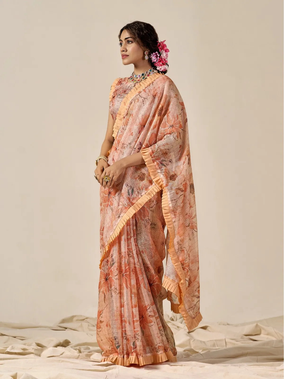 Tarani peach floral cotton blend Kota saree with ruffled border perfect for festive and party wear