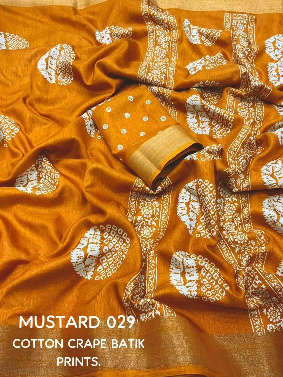 Tarani mustard cotton crape Batik print fabric closeup view showing texture and design