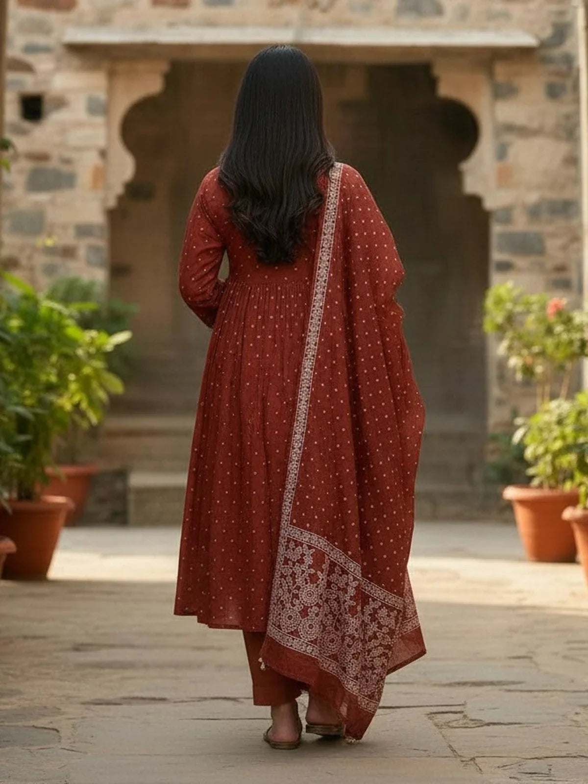 Tarani brown cotton dress back view with flowing dupatta and soft gathers