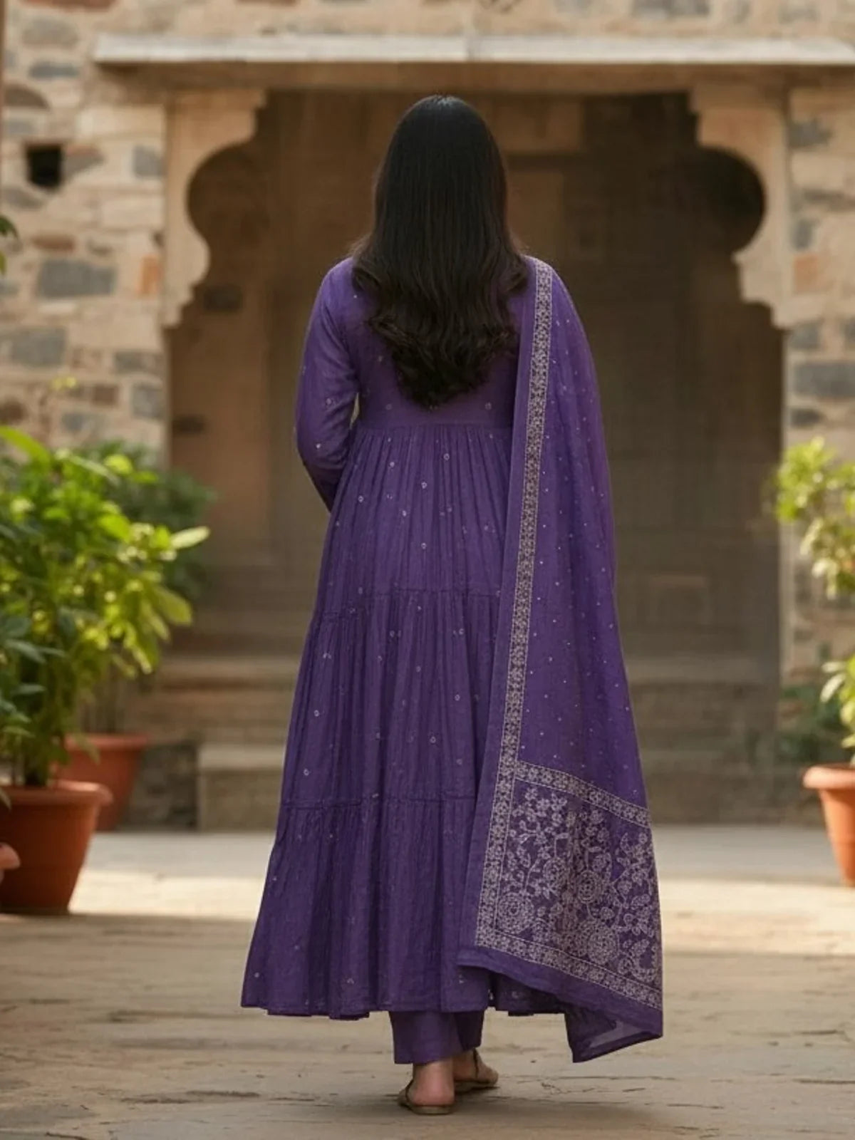 Back view of Tarani purple embroidered cotton dress with soft flowing silhouette