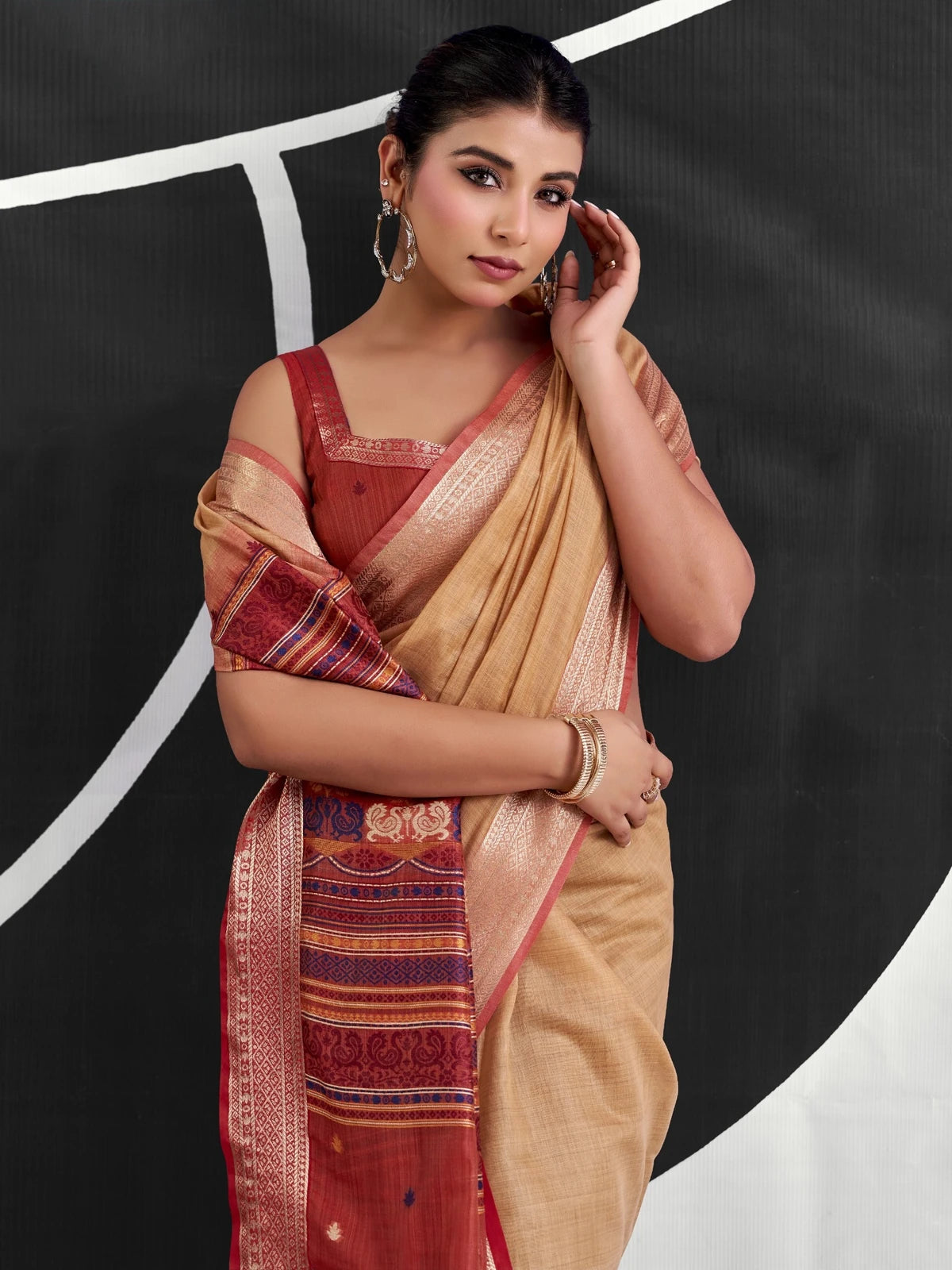 Tarani beige cotton modal saree upper body view showing zari border and blouse