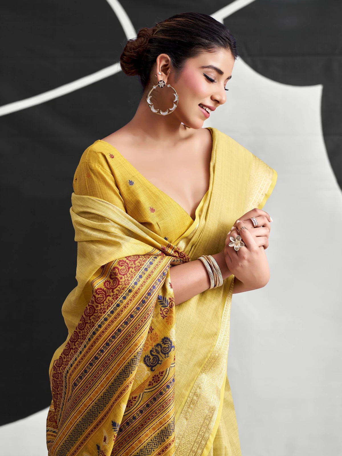Tarani mustard cotton modal saree closeup-view with woven border and contrasting printed pallu