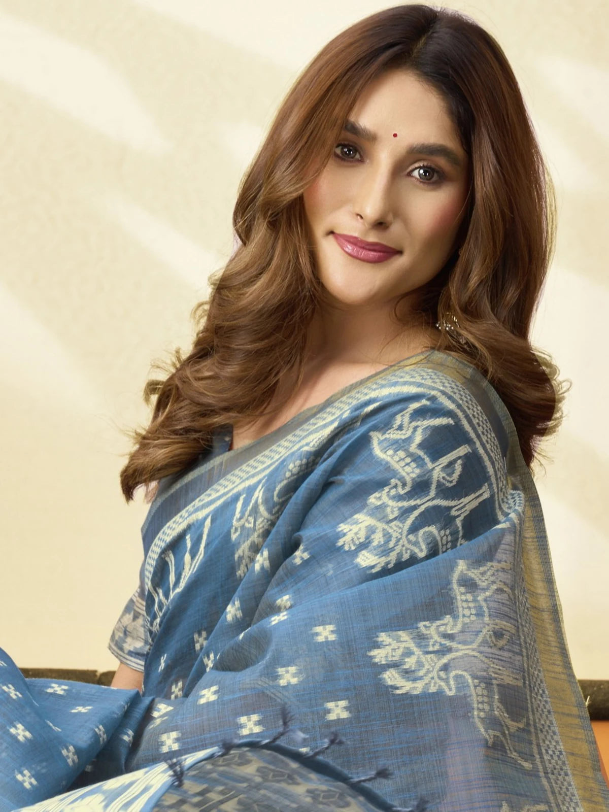 Tarani premium blue cotton saree closeup showing woven border and pallu detailing