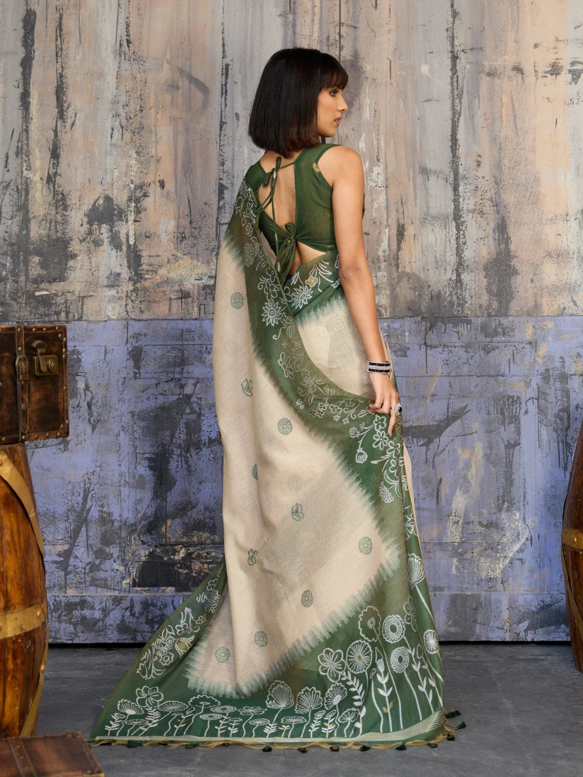 Tarani back view of munga cotton saree drape with tied blouse design and soft flowing pleats