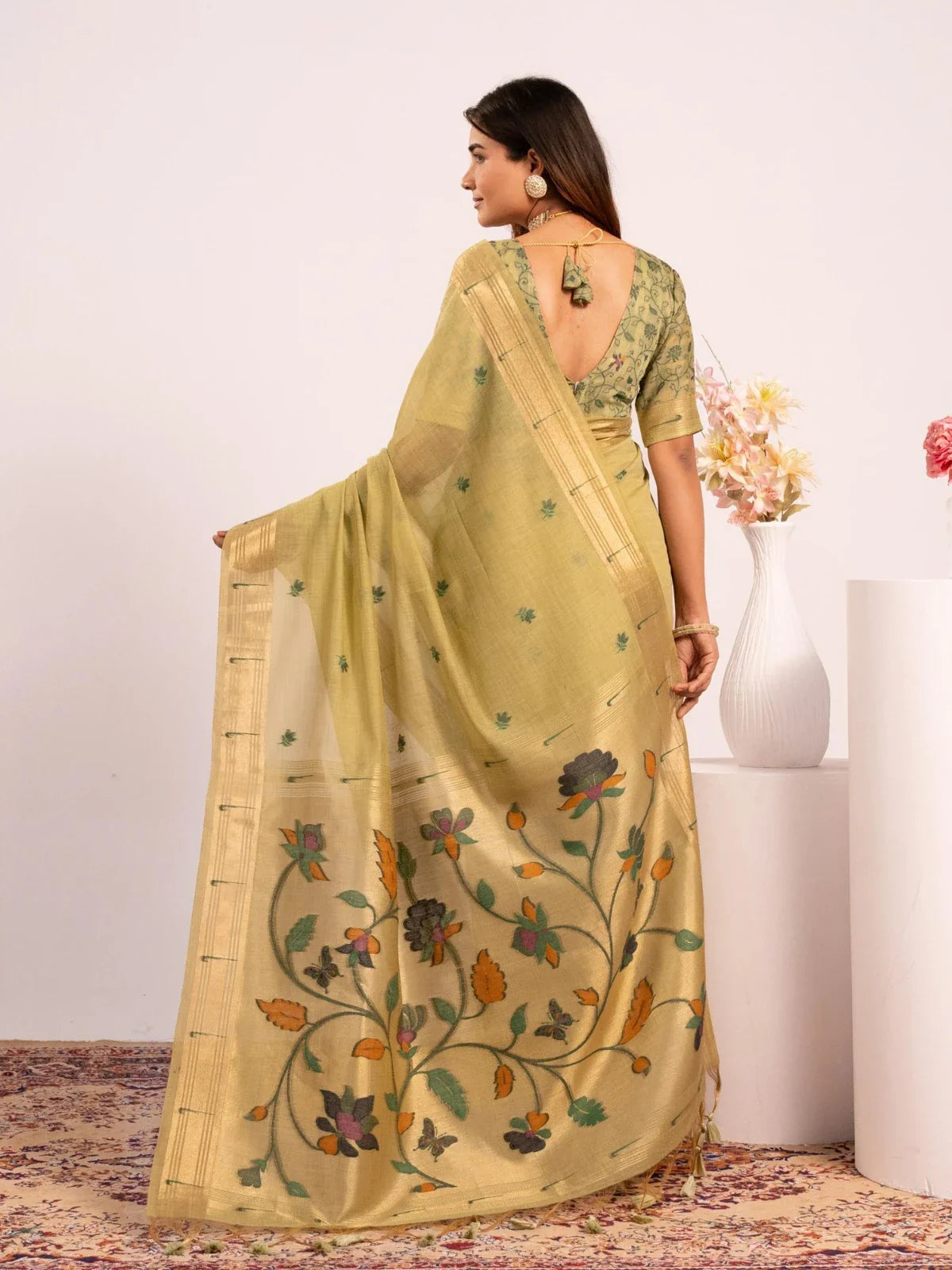 Tarani green cotton saree with contrast blouse and classic back view style