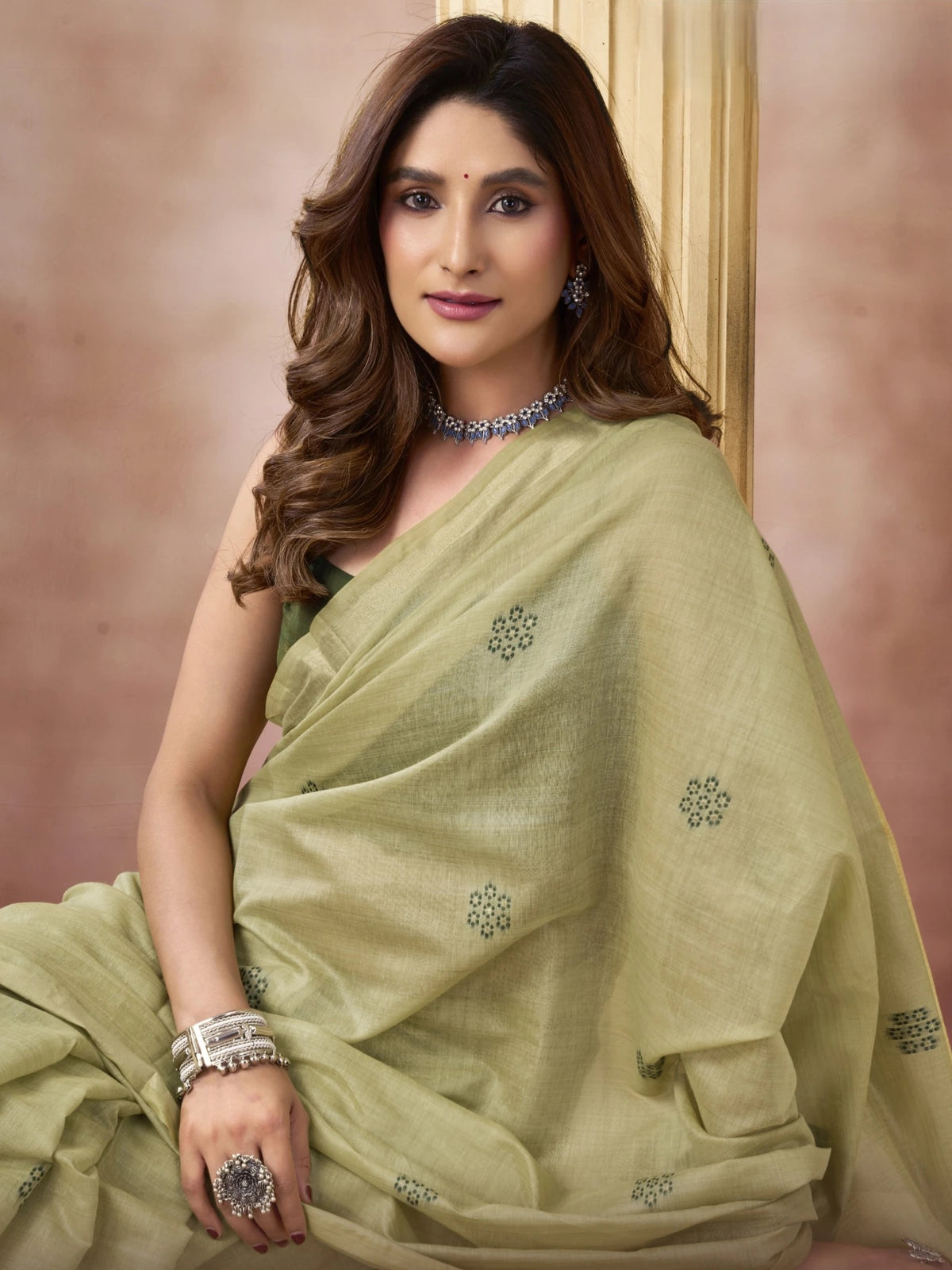 Tarani Chahna green cotton saree with subtle motifs in graceful front view