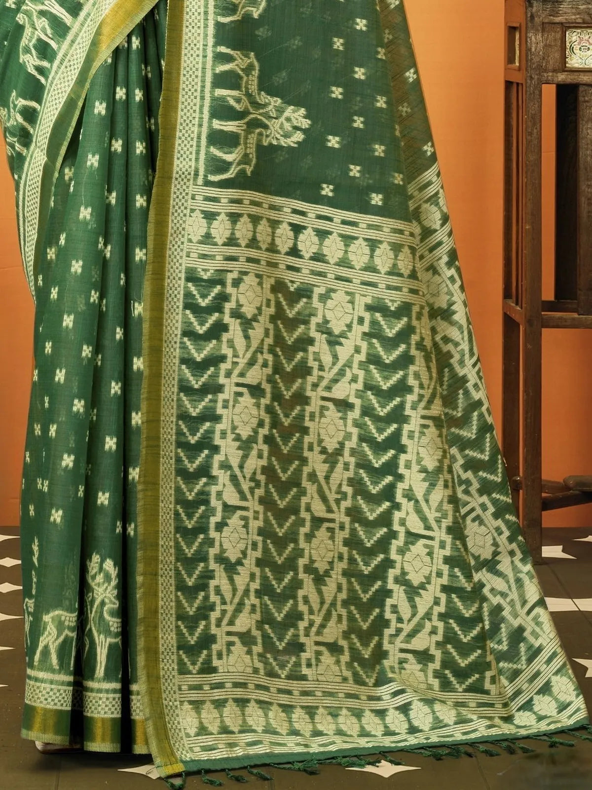 Tarani premium green cotton saree pallu close view with woven motifs and jhallar