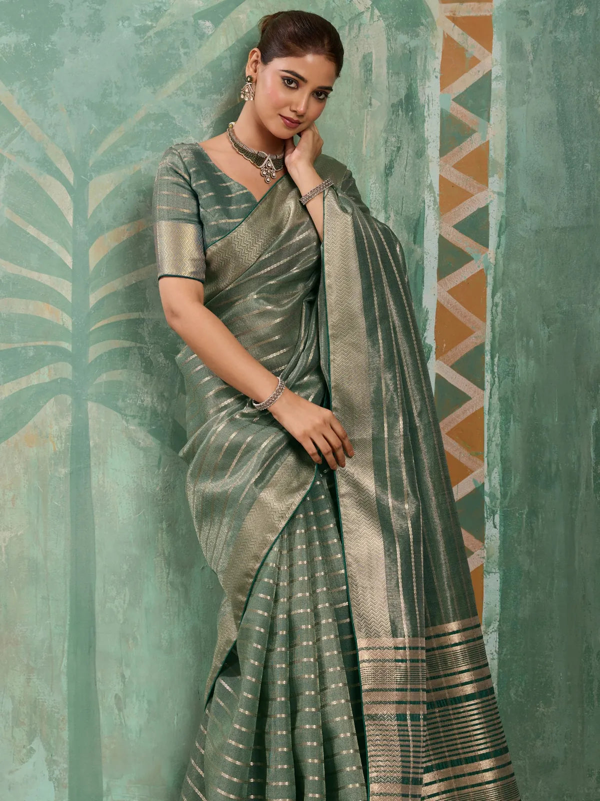 Tarani green cotton tissue saree with zari woven work upper body view