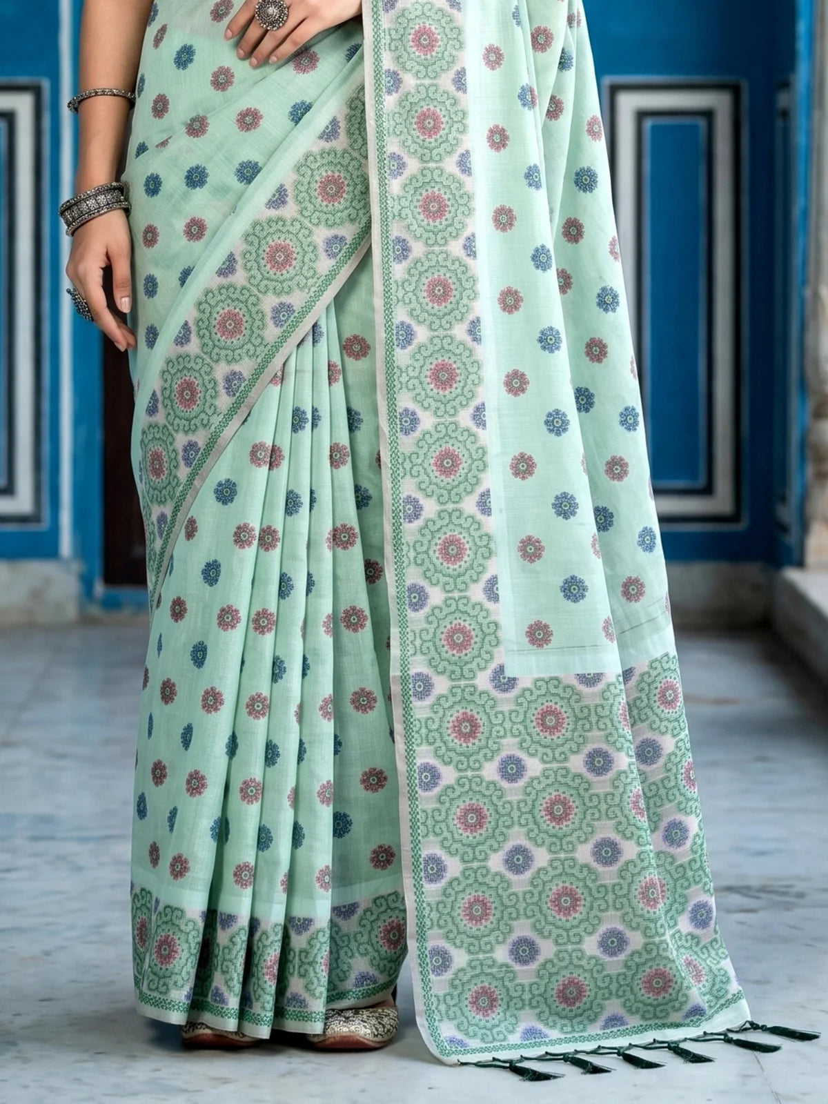 Tarani mint green printed cotton saree closeup view with blouse piece