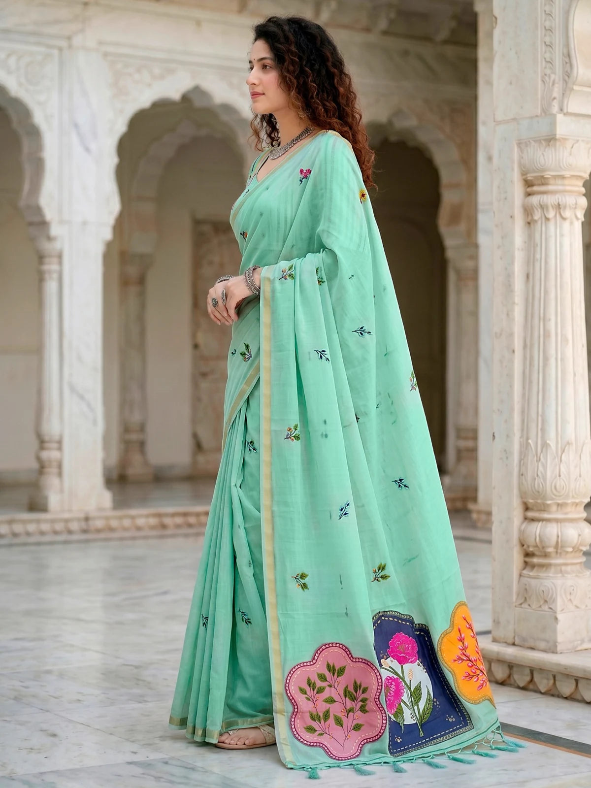 Tarani mint green cotton saree side-view showing woven floral work