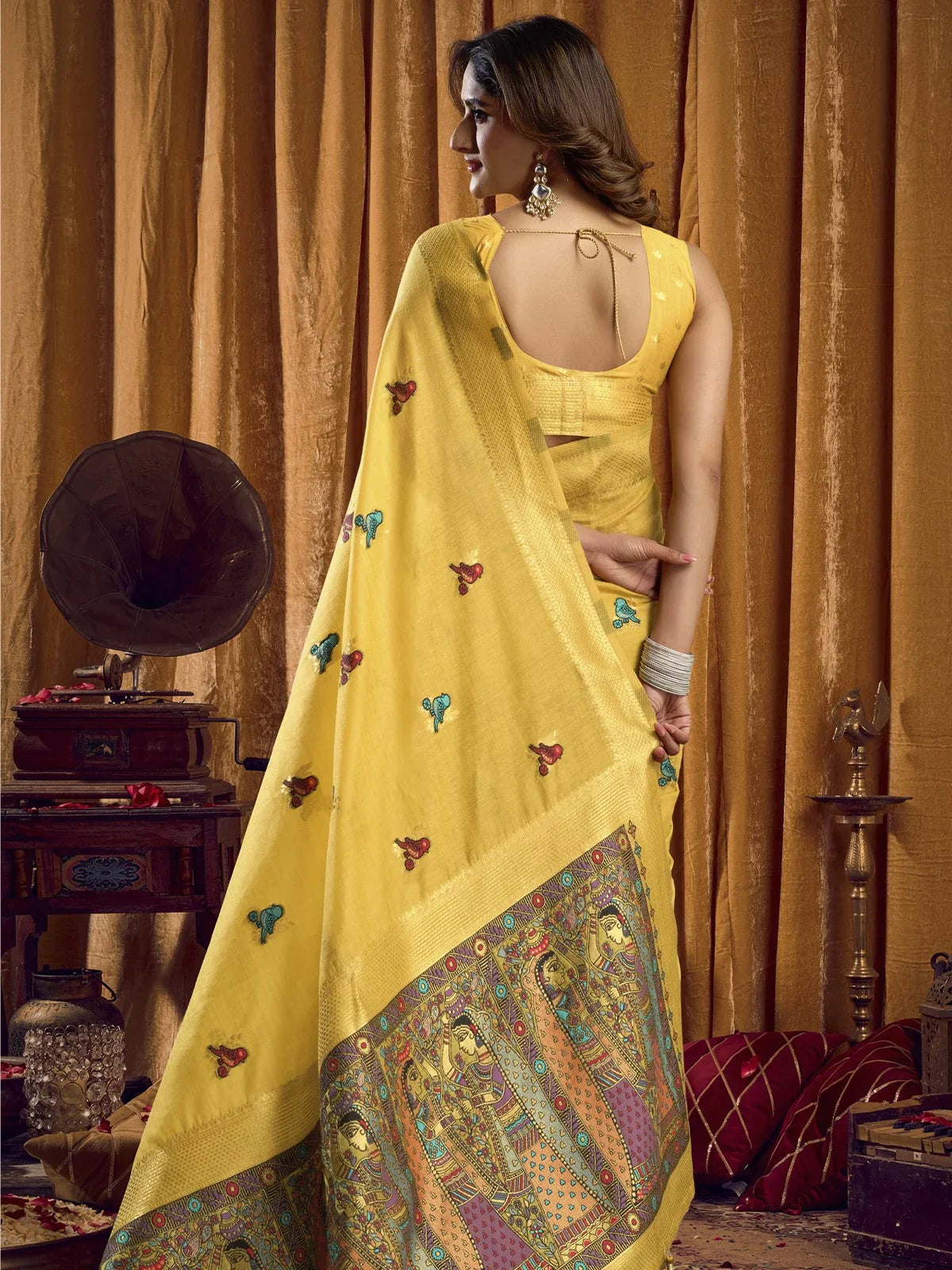 Tarani yellow khadi saree back view showing brocade blouse and detailed border