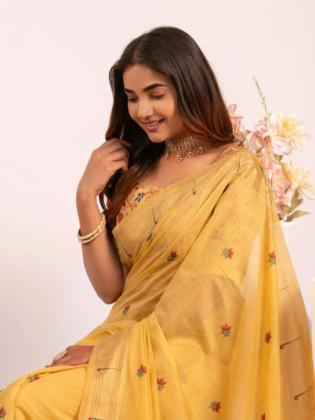 Tarani yellow cotton saree upper-body closeup with delicate resham and muniya weave
