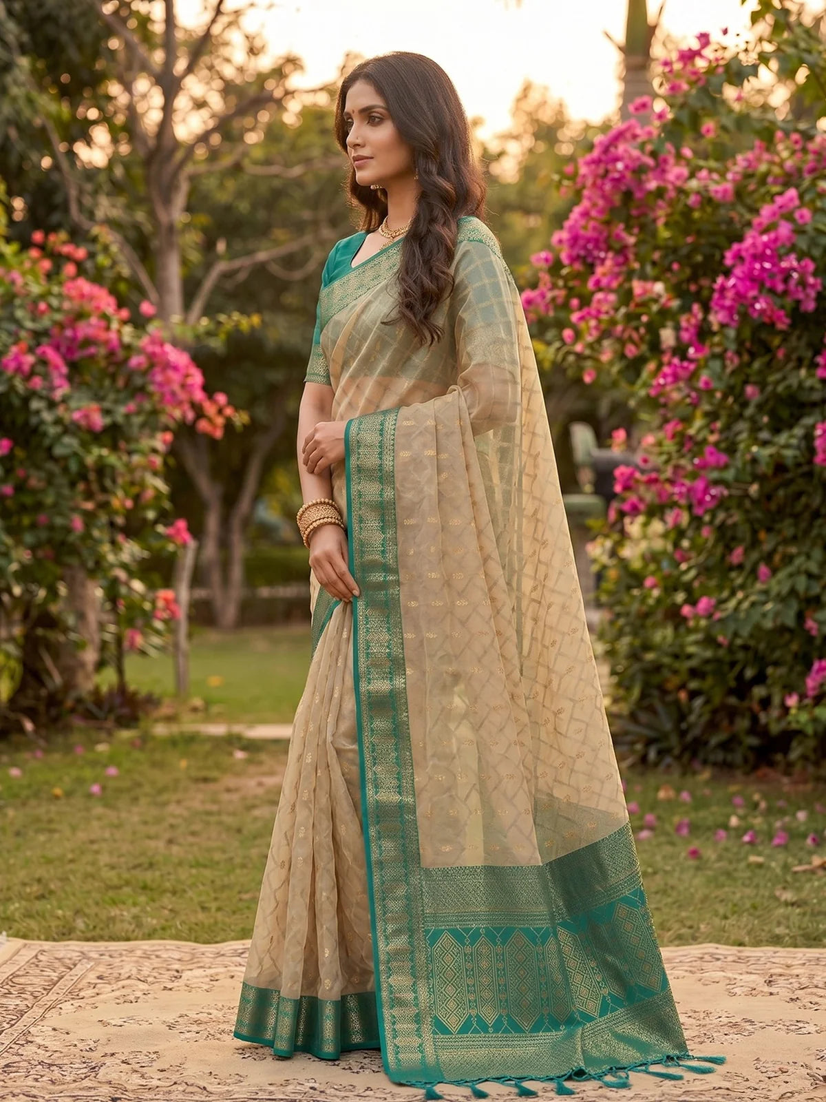 Tarani beige and teal cotton silk saree elegant side pose for ceremonial occasions
