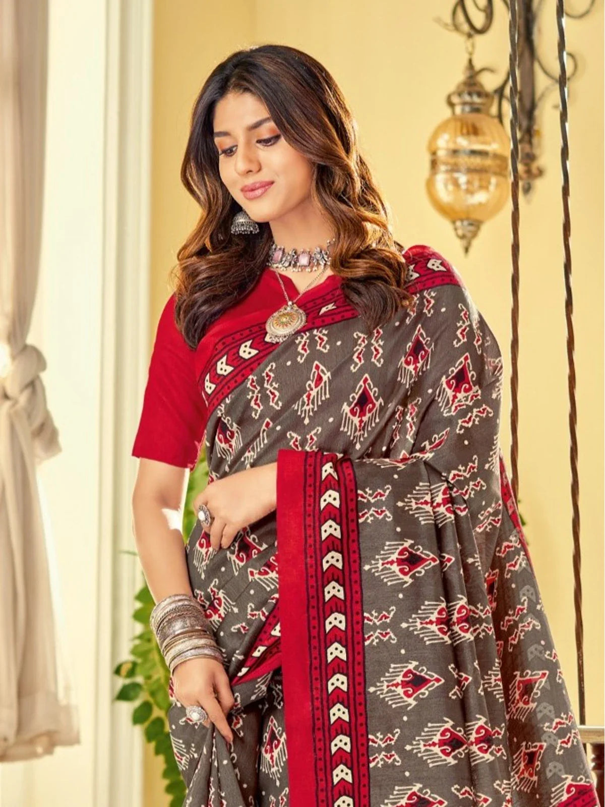 Tarani grey cotton silk saree upper body view showing red border and traditional design