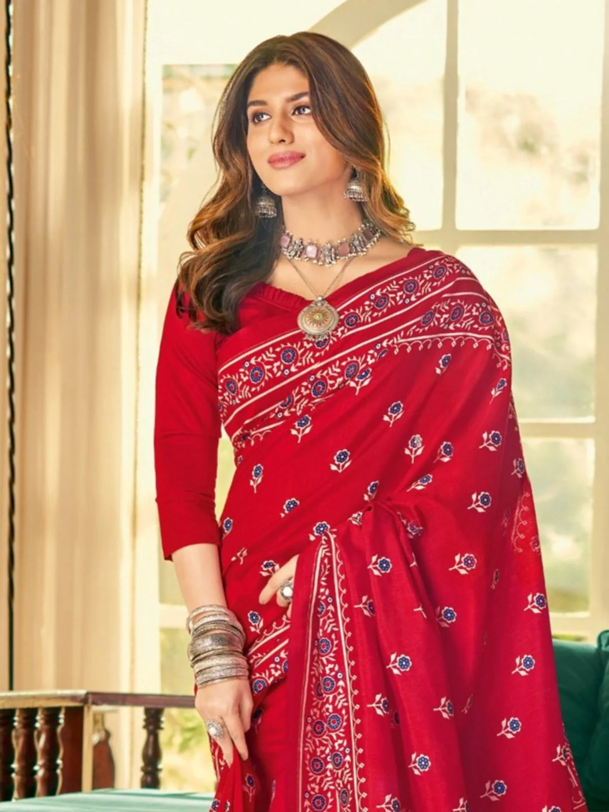 Tarani red cotton silk saree upper body view featuring intricate border and jewelry styling