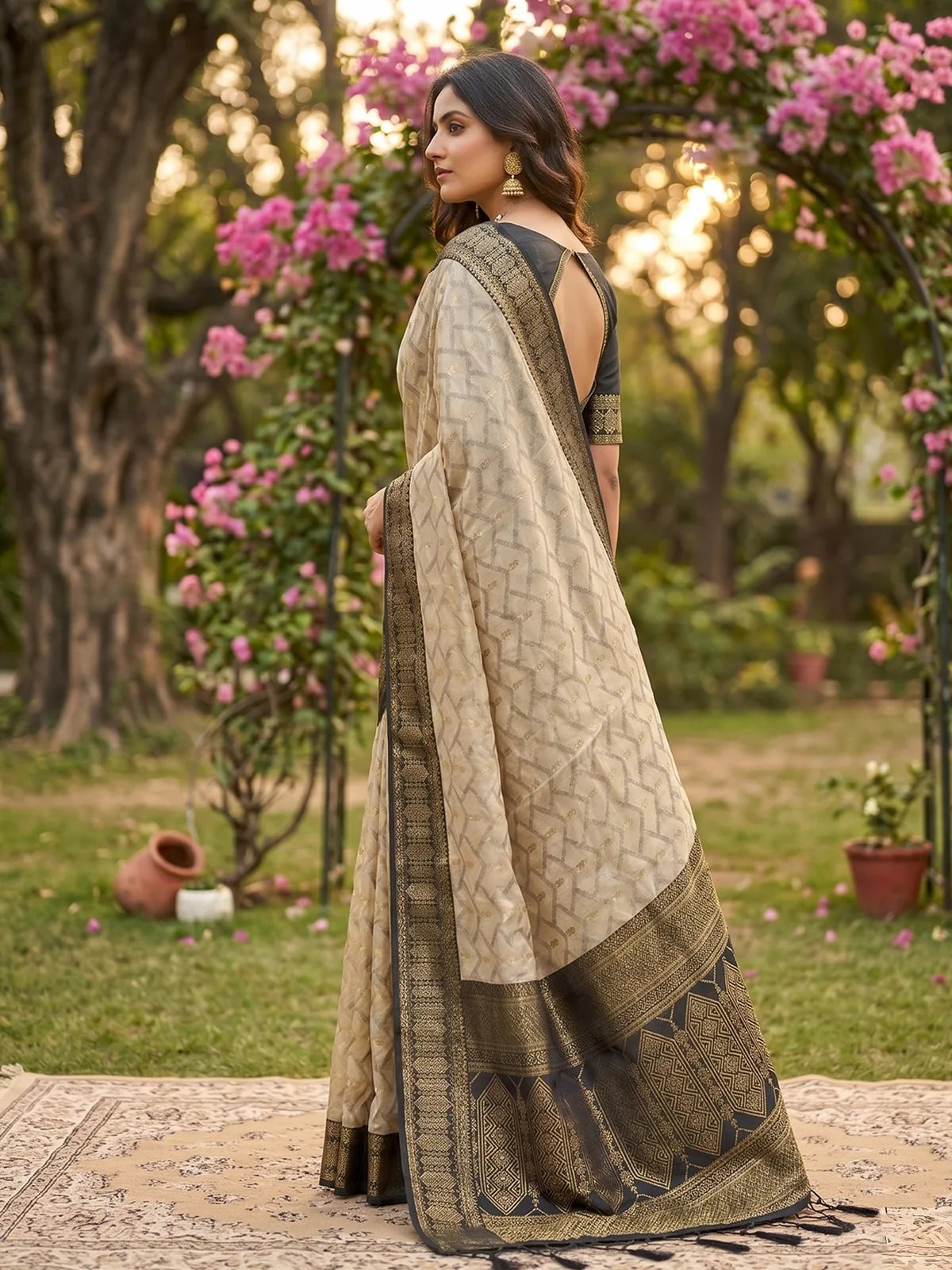 Tarani beige and black cotton silk zari border saree elegant side drape view for ceremonial occasions