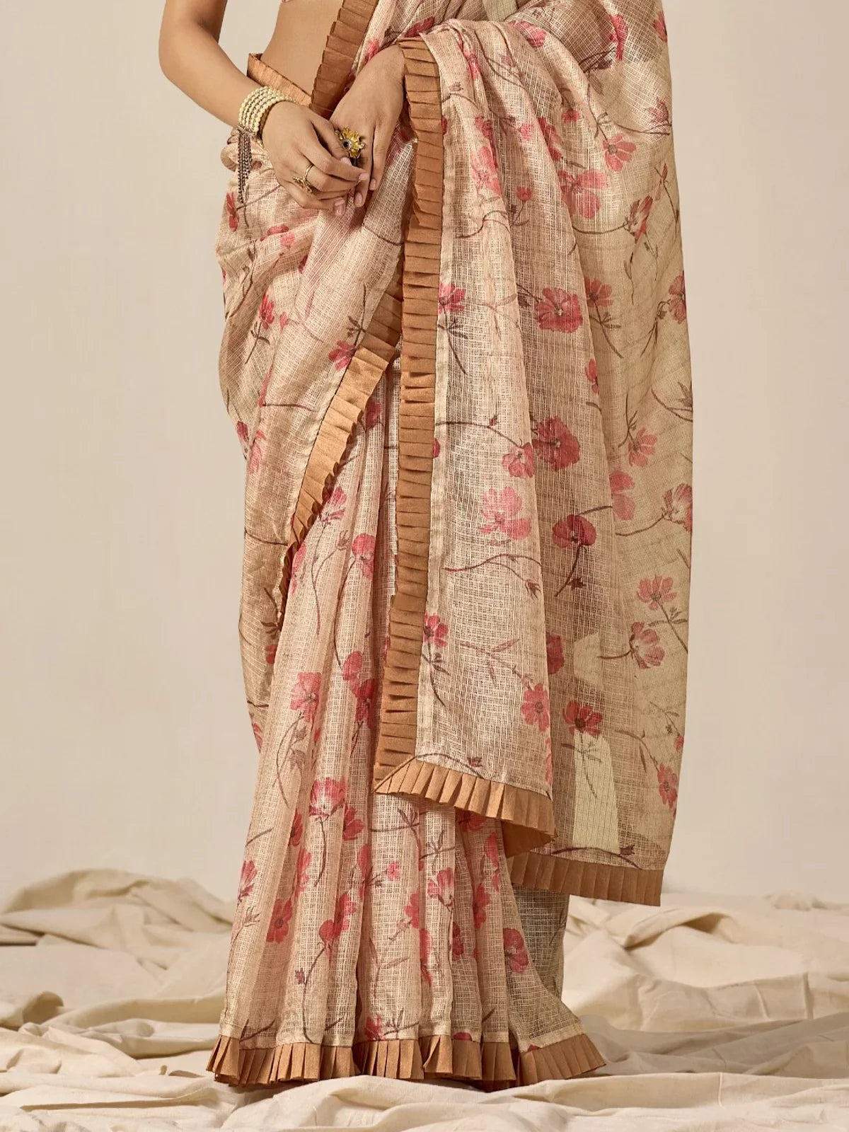 Tarani beige cotton blend saree close-up view highlighting floral detailing and pleated border