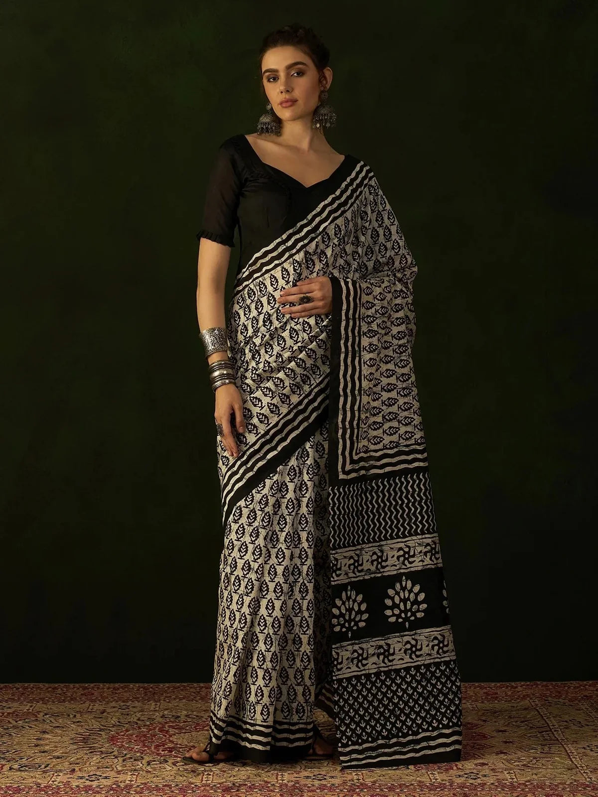 Tarani black cotton silk saree with batik-style print and running blouse perfect for festive and wedding wear
