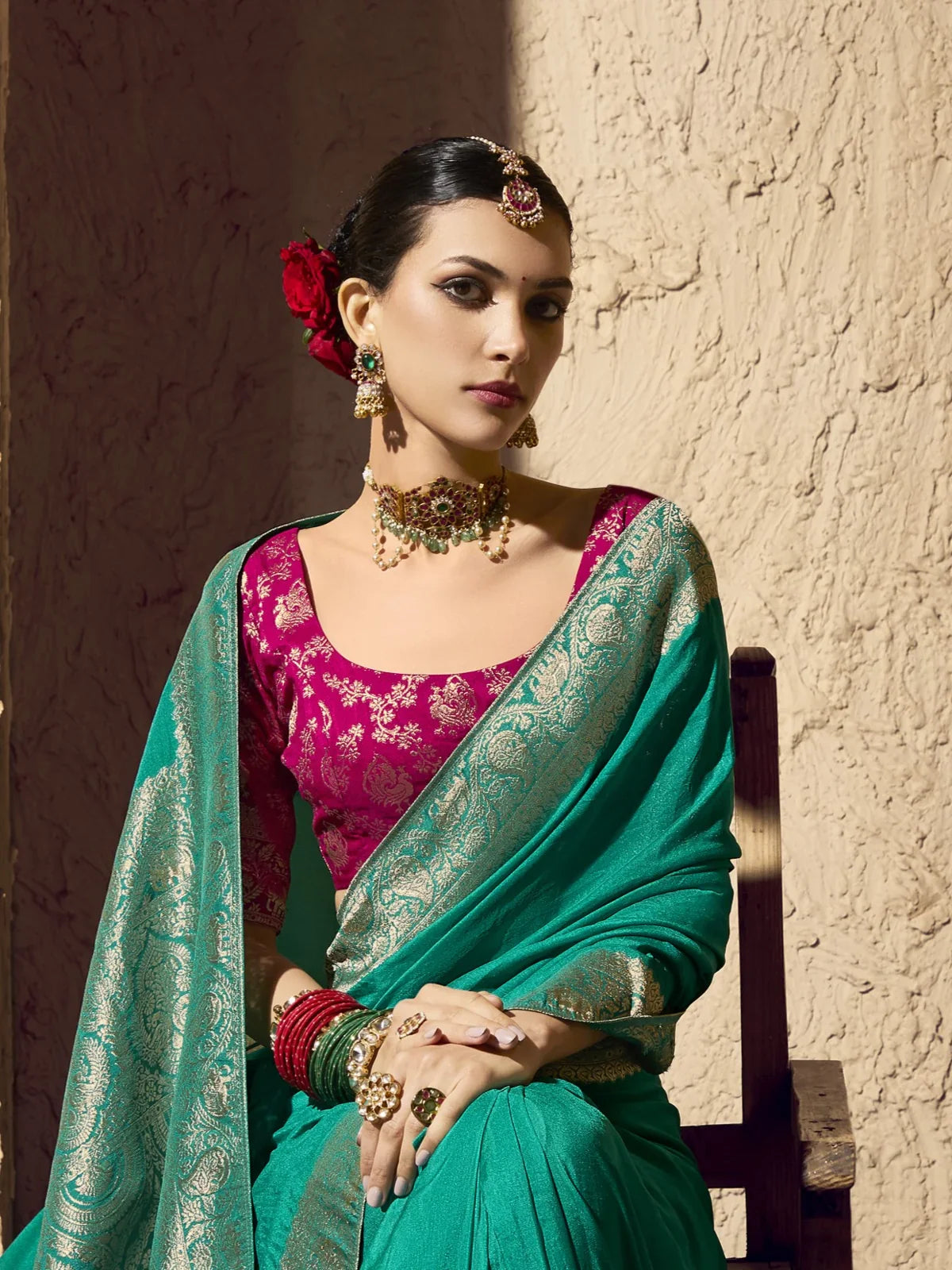 Tarani festive saree close-up showing premium green crepe fabric and traditional pink blouse