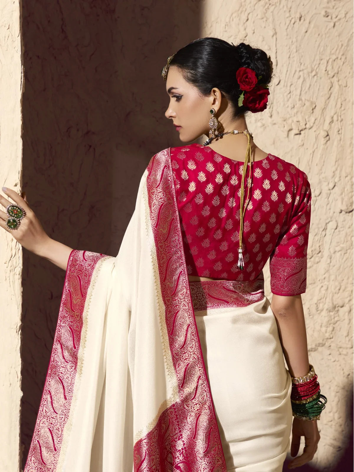 Tarani blouse back view of maroon blouse with gold butti and zari work paired with crepe saree