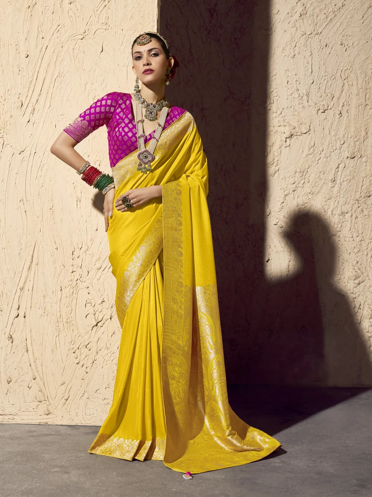 Tarani yellow crepe georgette saree with zari work and pink contrast blouse full view