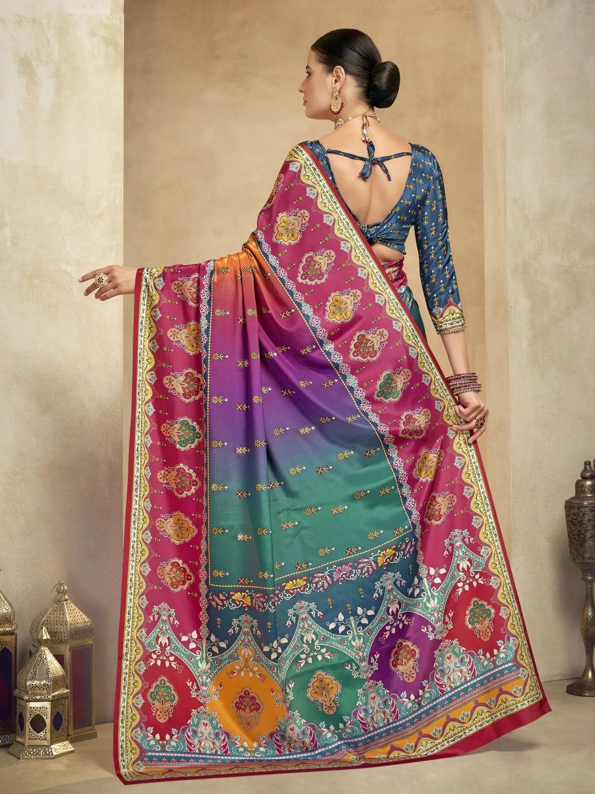 Back view of Tarani crepe saree in magenta with blue blouse and foil motif detailing