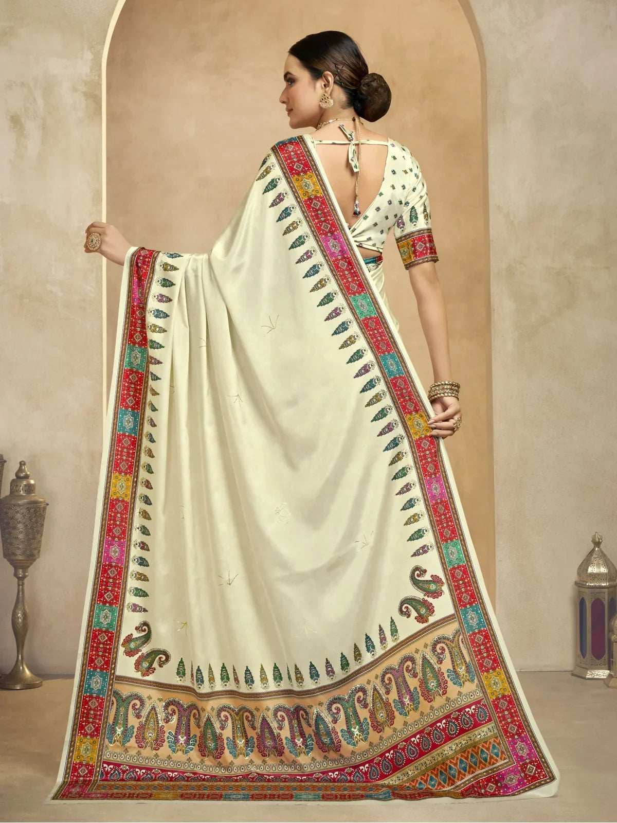 Tarani cream crepe saree back view with elegant blouse design and foil print on shoulder
