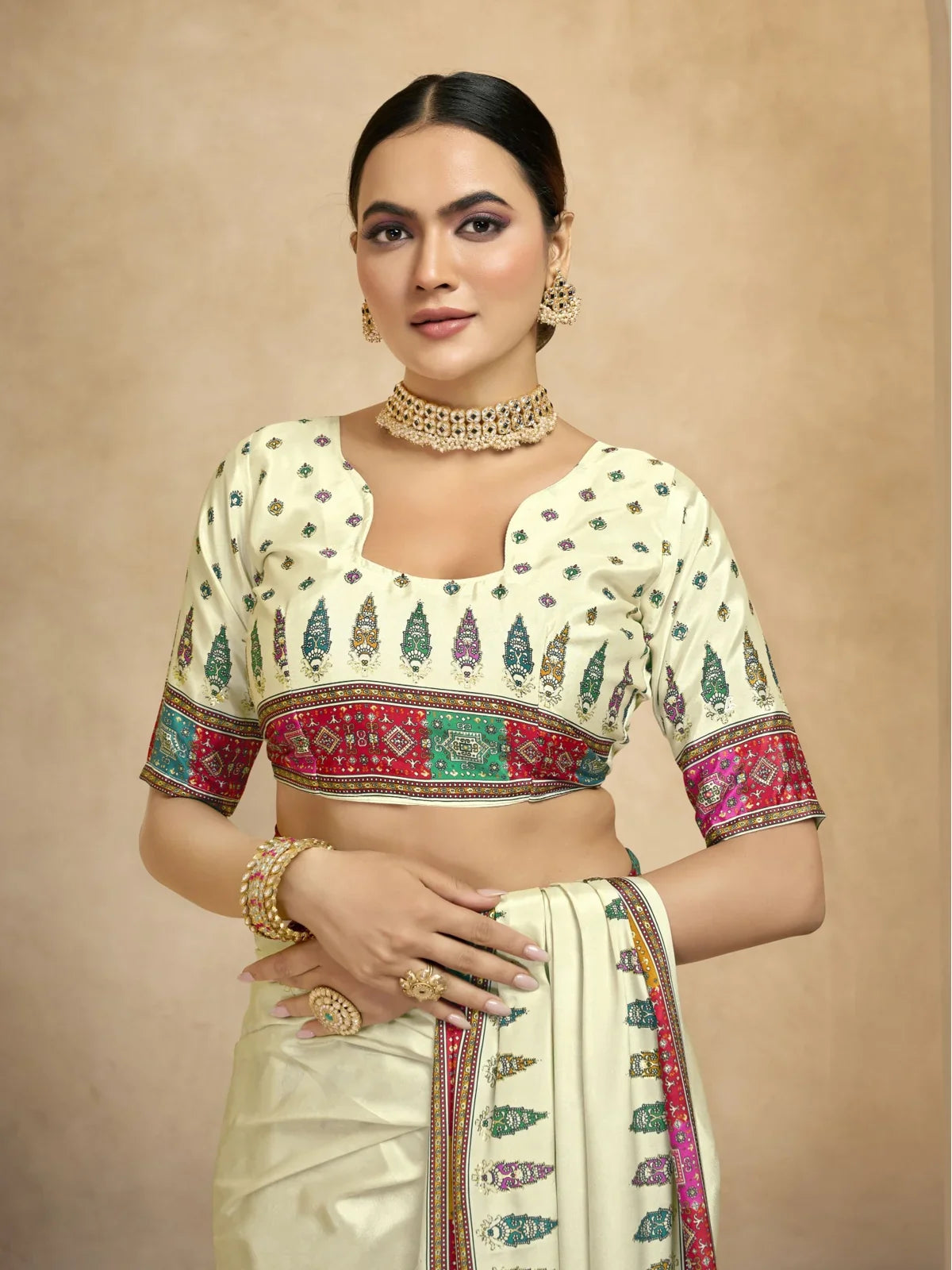 Tarani cream crepe saree upper body view with multicolor blouse and foil printed pattern